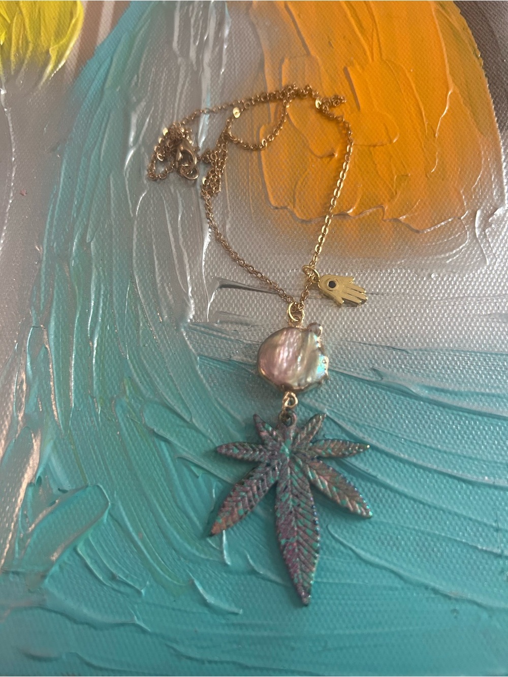 Gold Chain Necklace with Iridescent Pearl and Patina Cannabis Leaf Pendant